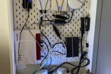 20 a wall-mounted metal box with lots of cords and a wi-fi router is a lovely idea to hide every eye sore