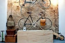 22 metal holders on the wall and a plywood unit for storing bikes are amazing and they match the industrial space