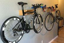25 stylish and minimal wall-mounted bike shelves can be attached anywhere in your home and they will easily hold your bikes