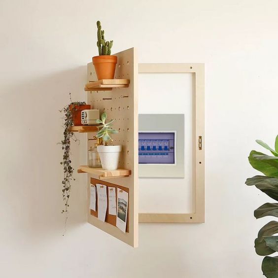 attach your wi fi router to the wall and then cover it with a shelving unit like here