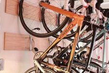 28 wooden shelves with hooks can securely store several bikes and can be a nice idea for any shed or other space