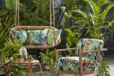 29 a tropical terrace with wooden and rattan furniture, colorful upholstery and a rattan coffee table and layered rugs plus lots of tropical plants