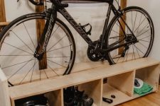 30 a crate shelving unit for shoes and for your bike on top is a simple and cool DIY, and this piece is very functional