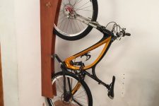 32 a creative and cool wall-mounted holder for a bike is a smart and stylish idea to store your bike comfortably and to show it off at the same time