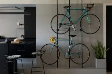 40 metal slabs are great to hold your bikes and they look stylish and cool and integrate them into the interior in a lovely way