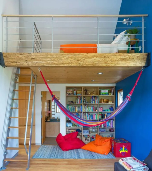 a colorful kids' space with a lower level for reading and just relaxing and the upper level as a bedroom