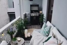 a cozy Nordic balcony with potted plants, printed textiles and a grill – all you need in one