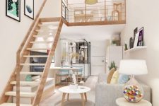 a lovely modern space with plenty of light, with a kitchen, dining and living room down, a ladder and a loft sleeping space, a cluster of pendant lamps