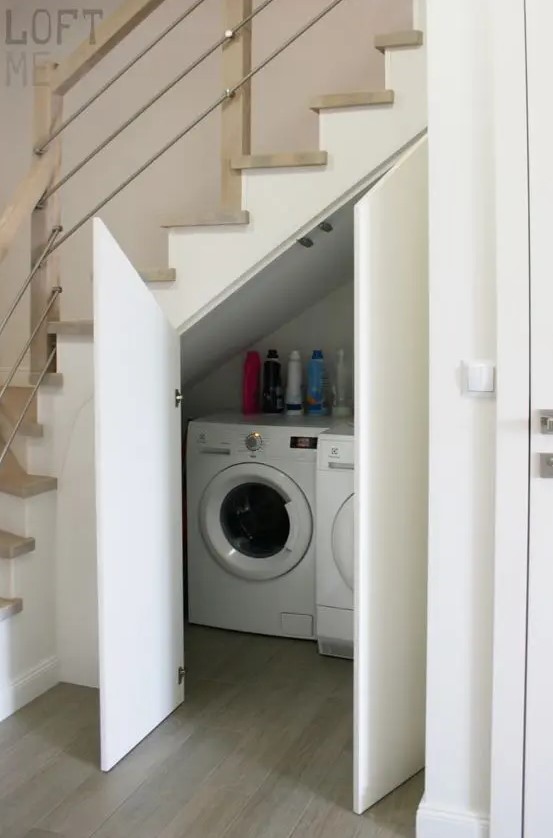 a small laundry with a washing machine and a dryer and with doors to hide them is a cool and smart idea to rock