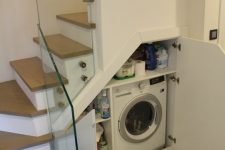 a small under the stairs space can be also turned into a laundry – build in a washing machine and some shelves for storage there, too