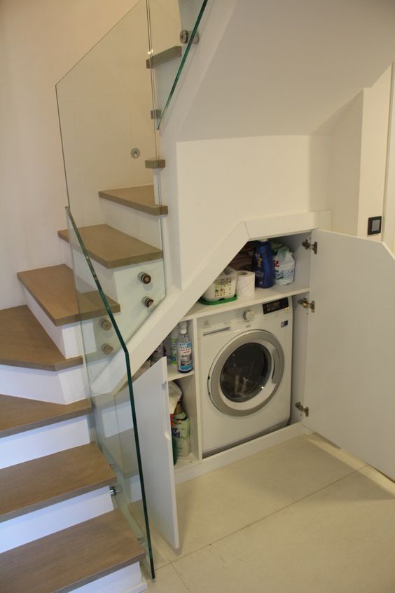 a small under the stairs space can be also turned into a laundry   build in a washing machine and some shelves for storage there, too