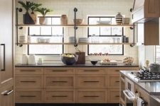 a stained kitchen with shaker style cabinets, black stone countertops and black handles, long open shelves instead of upper cabinets is cool
