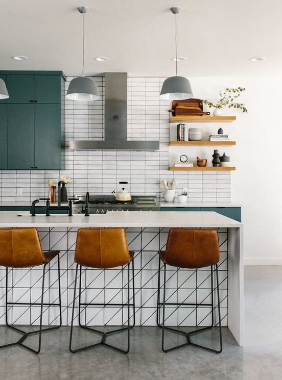 a blue kitchen with a white skinny tile backsplash and white stone countertops is a very chic and bold idea