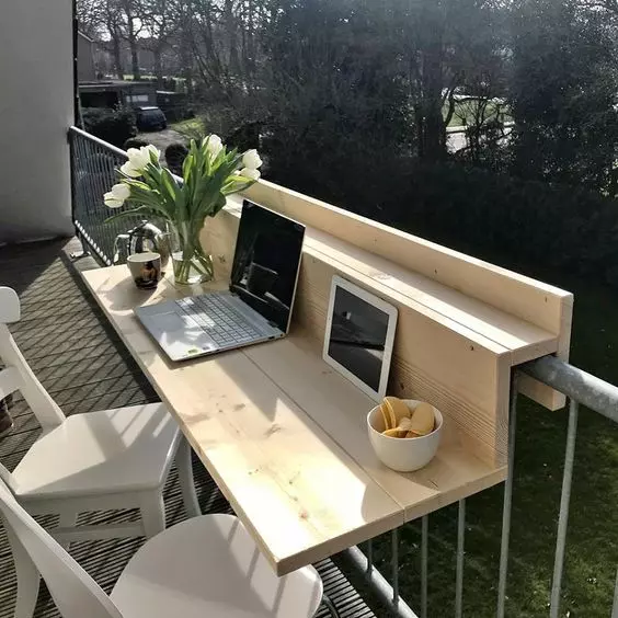 a light-stained railing table or desk is great for working, having meals and drinks and you may place some planters on it, too