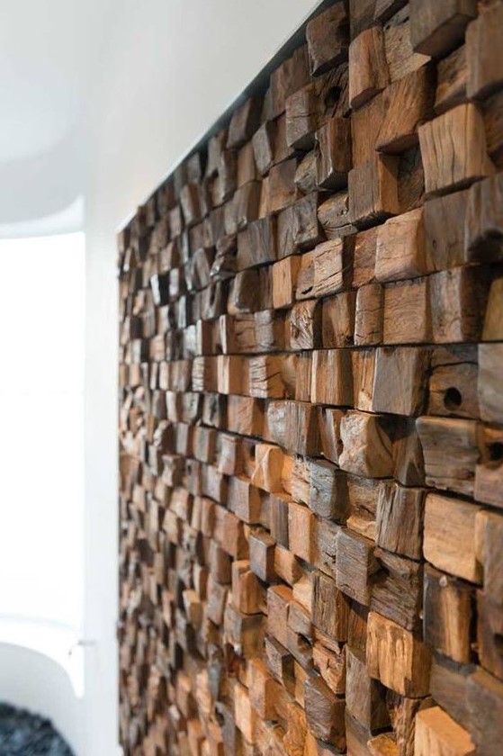 a textural weathered and driftwood piece wall creates a check pattern and adds a character to the room