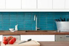 05 a chic kitchen in white and stained wood, with a turquoise skinny tile backsplash is very stylish