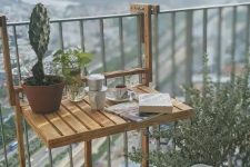 05 a little wooden folding table that can be hung on the railing is a brialliant idea for a tiny or small balcony and it looks eco-friendly and natural