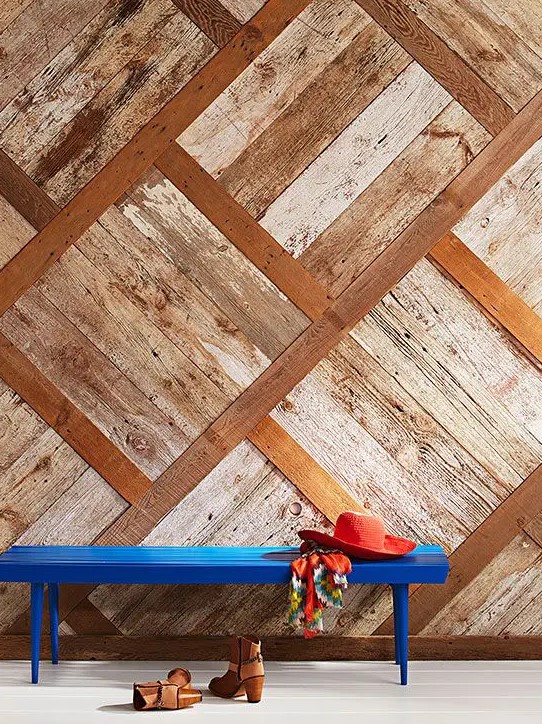 a textural weathered wood wall with a geometric pattern brings rustic chic and a relaxed shabby feel