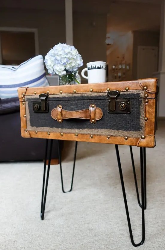 a chic and stylish vintage side table made of a vintage suitcase placed on hairpin legs is a lovely idea to rock