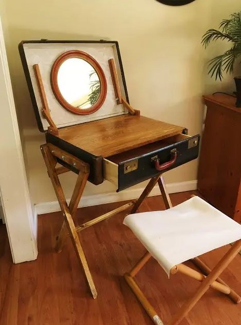a creative mini makeup table of a vintage suitcase, a mirror and a tabletop can be DIYed if a usual vanity isn't your thing