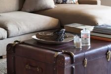 09 a leather vintage suitcase as a coffee table with a lot of storage and a very chic and bold look