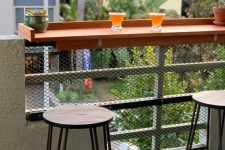 09 a small tabletop attached to the railing of your balcony can serve as a desk, a bar counter or even a planter stand and it’s easy to install