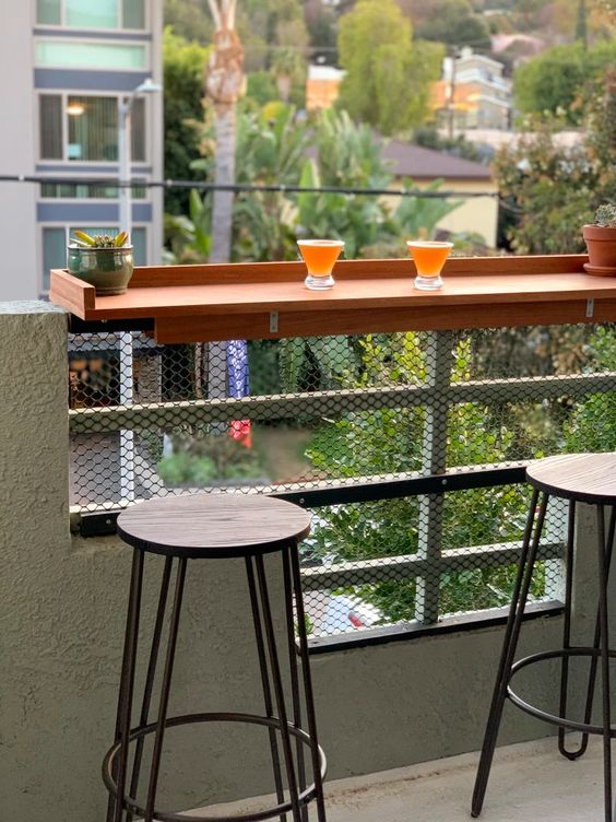 a small tabletop attached to the railing of your balcony can serve as a desk, a bar counter or even a planter stand and it's easy to install