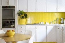 a cute kitchen with yellow accents