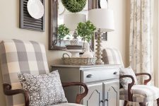 10 farmhouse home decor with a mirror in a chic frame, stained shutters, lates, potted greenery and a greenery wreath
