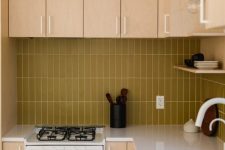 11 a light colored plywood kitchen with a mustard skinny tile backsplash and white fixtures for a fresh touch