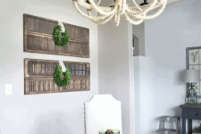 12 rustic home decor with stained shutters on the wall with greenery wreaths is a lovely idea for a farmhouse space