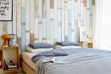 13 an accent wall done with various shabby wooden planks in white, beige and blue adds a nonchalant touch to the bedroom