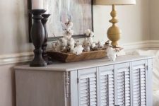 18 a delicate whitewashed sideboard with shutter doors is a lovely idea for a rustic or seaside space, it will add a slight touch of color and a rustic feel to the space
