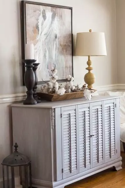 a delicate whitewashed sideboard with shutter doors is a lovely idea for a rustic or seaside space, it will add a slight touch of color and a rustic feel to the space