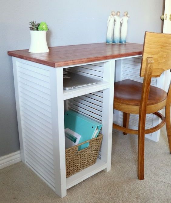 a desk made of repurposed shutters, with a stained tabletop and a basket for storage is a lovely idea for a rustic or seaside space