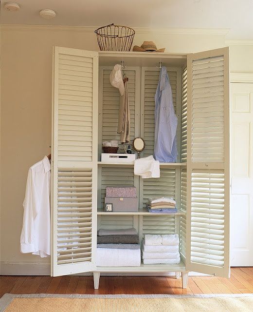 a lightweight and airy shutter cabinet can be used as a wardrobe or for storing any other things that you want