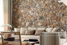 20 a rough stone accent wall adds a natural feel to the contemporary living room and brings a touch of natural color