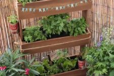 20 a vertical tiered wooden planter with greenery won’t take much floor space but will refresh your little space a lot and make it cooler