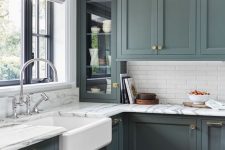 21 an elegant vintage green kitchen with skinny white tiles and marble countertops for a more refined and stylish look