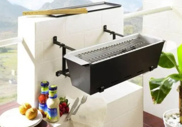 a mini metal grill box that can be attached to a wall or a railing is a very cool solution for a small balcony if you love grilled food