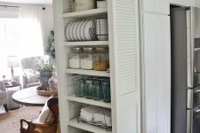 27 a rustic tall shelving unit with lots of shelves composed of shutters is an ideal piece to store and display all the stuff you have