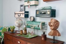 29 a whole gallery wall of cut vintage suticases with vintage decor is a lovely idea for a vintage-infused or eclectic space