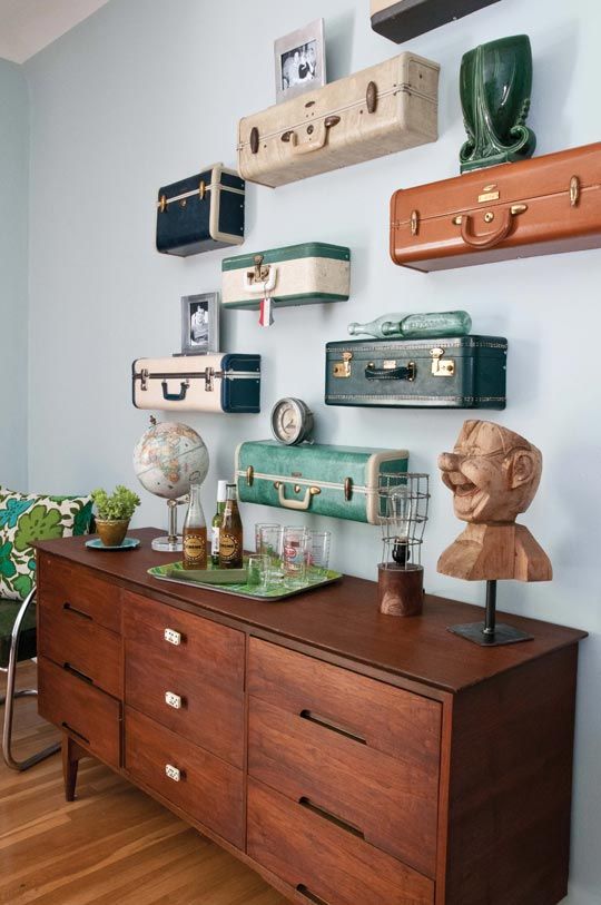 a whole gallery wall of cut vintage suticases with vintage decor is a lovely idea for a vintage-infused or eclectic space
