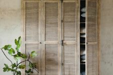 32 a beautiful rustic wardrobe with shutter doors is a lovely idea for a rustic space or a shabby chic one