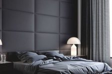 33 a black padded fabric statement wall perfectly fits a moody contemporayr bedroom with a masculine feel