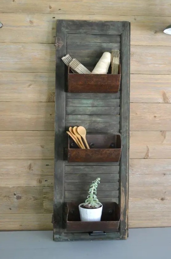 farmhouse storage shutter with old loaf pans for a vintage feel in your kitchen is a unique DIY project