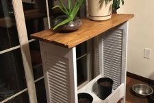 36 repurposed shutters and pallet wood into a plant shelf or table is a cute idea to add a character to the space