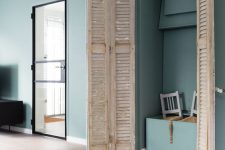 39 a built-in storage unit finished off with shabby chic shutter doors looks very eye-catchy and adds a rustic feel to the sleek contemporary space