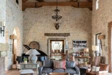 a living room with stone walls