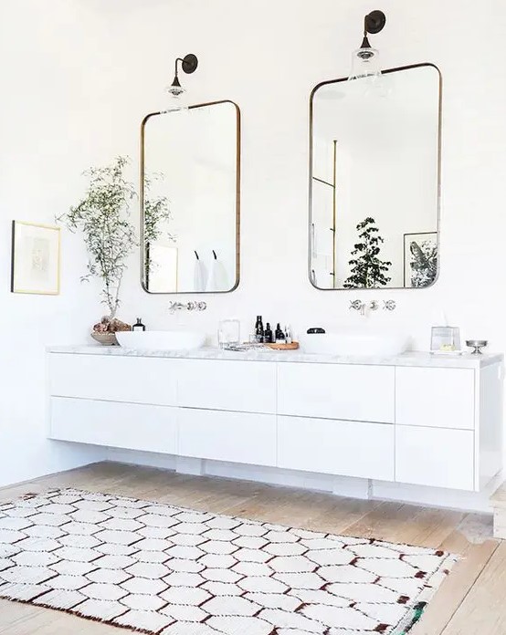 a beautiful and airy neutral bathroom with a white floating vanity with a stone countertop and bowl sinks is a lovely idea for a modern space
